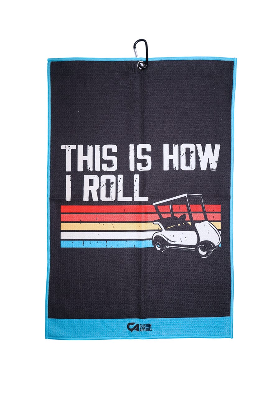 Golf cart-themed microfiber towel with black background and colorful stripes, ’this is how i roll’ text.
