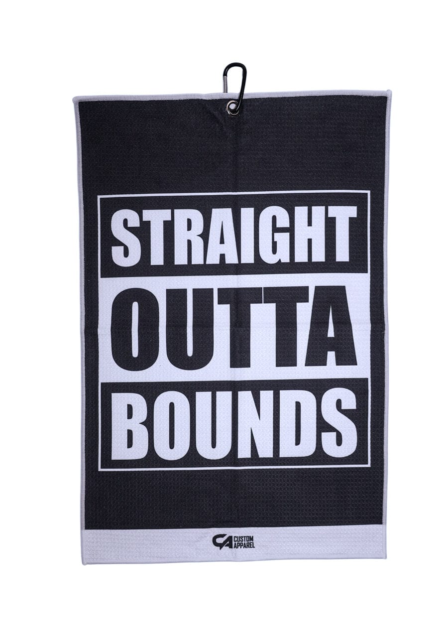 Black and white golf towel with ’straight outta bounds’ text design, featuring a hook for easy hanging.