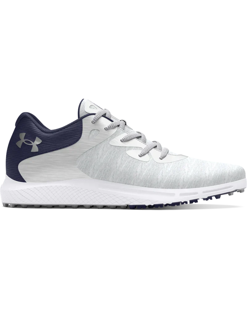 White and navy blue under armour golf shoe with textured upper material.